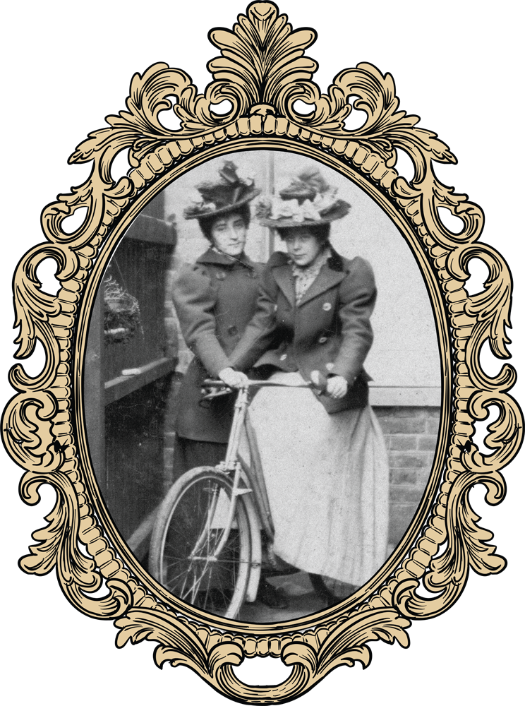 black and white photograph of two Victorian women and a bicycle