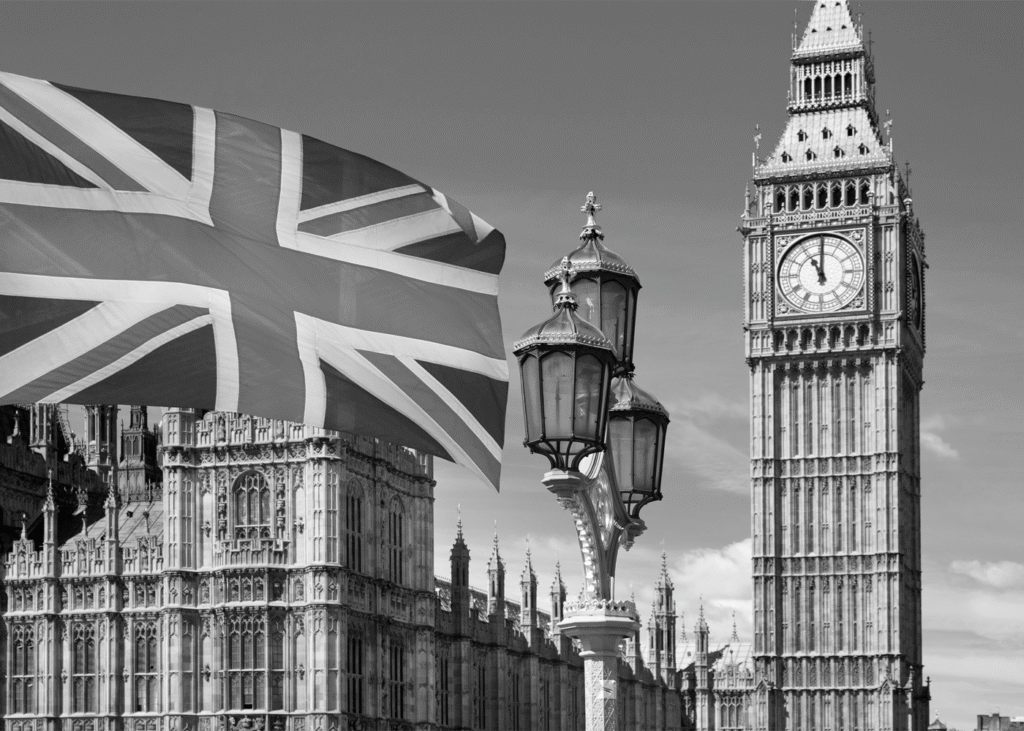black and white photograph of Big Ben and the British flag
